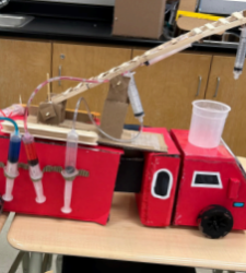 Red fire engine made out of recycled parts