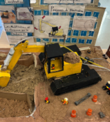 Yellow digger made out of recycled parts